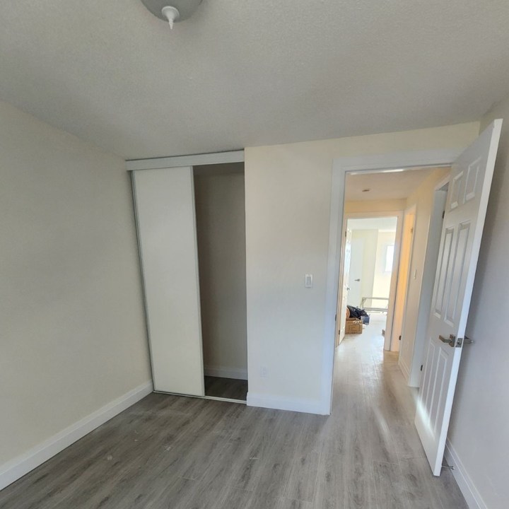 Bedroom Showing Door And Closet