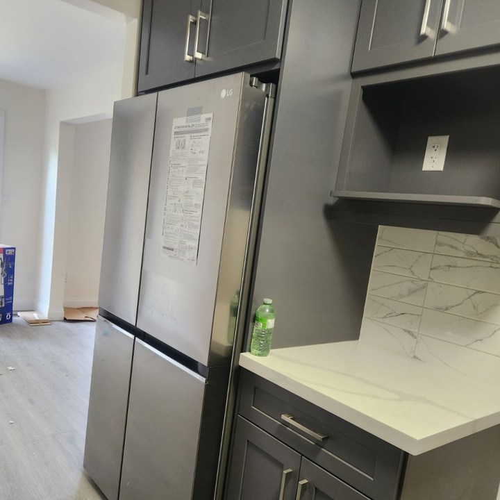 Kitchen With Fridge And Small Counter