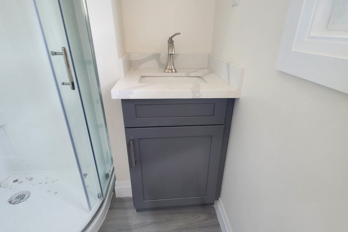Small Vanity Beside Shower Stall