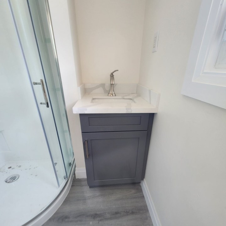 Small Vanity Beside Shower Stall